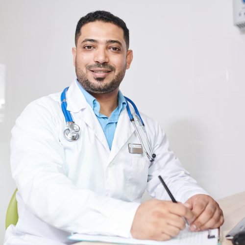 Middle-Eastern Doctor Posing at Workplace